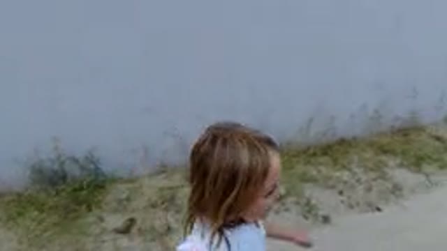 LOS CABOS MEXICO-2019: Little Girl Playing In The Street While Her Mother Is Waiting