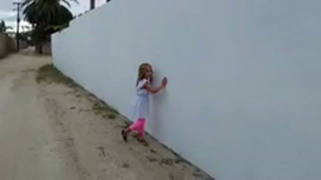 LOS CABOS MEXICO-2019: Small Child Skips Happily And Excitedly Down An Empty Road
