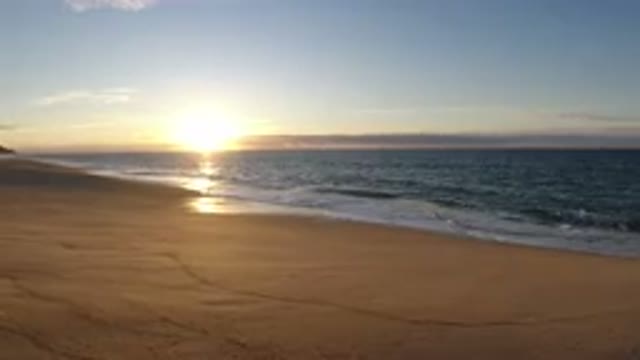 LOS CABOS MEXICO-2019: Quiet Morning On Beach With Waves Coming In And Sun Rising