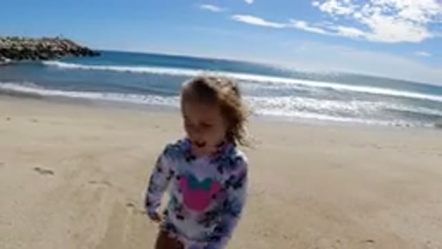LOS CABOS MEXICO-2019: Little Girl At The Beach Talking And Walking Around On A