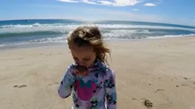LOS CABOS MEXICO-2019: Young Girl Tasting Ocean Air at the Beach