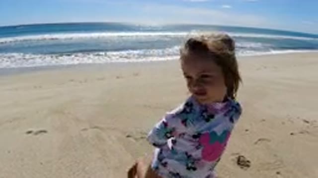 LOS CABOS MEXICO-2019: Little Cute Girl Playing in the Beach Sand