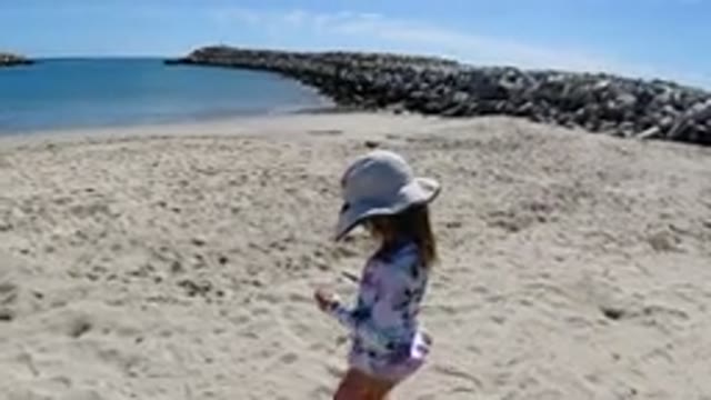 LOS CABOS MEXICO-2019: Women Playing With Little Girl In The Sand On A Beach