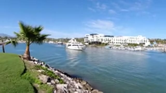 LOS CABOS MEXICO-2019: Boat Journey Past Trees and Buildings