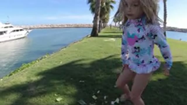 LOS CABOS MEXICO-2019: Child Girl Catching Body of Water Grass Trees Marina Sea