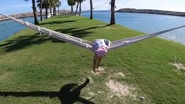LOS CABOS MEXICO-2019: Girl Trying To Climb To A Hammock During Her Vacations At