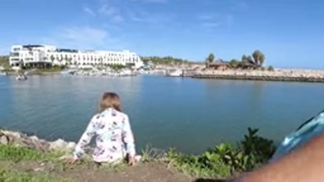 LOS CABOS MEXICO-2019: Summertime The Little Girl Playing Next To The River