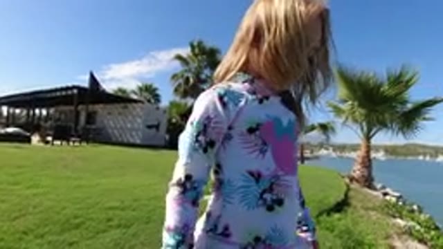 LOS CABOS MEXICO-2019: Child Girl In A Park Full Of Grass And Rocks Going To A