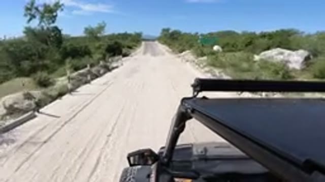 LOS CABOS MEXICO-2019: Jeep Traveling On The Road With Sign Board