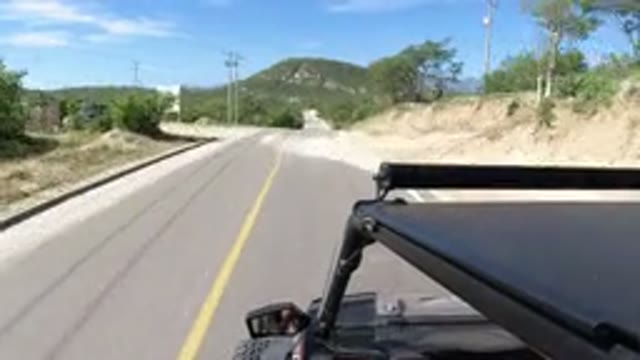 LOS CABOS MEXICO-2019: Camera On Top Of Jeep As The Wrangler Drives Down The