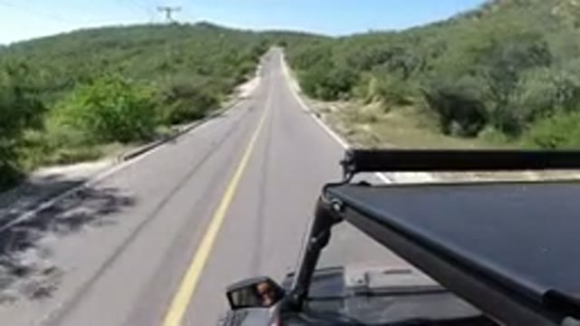 LOS CABOS MEXICO-2019: Camera Mounted On Top Of A Jeep That Is Driving Down A