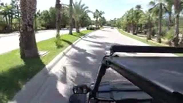 LOS CABOS MEXICO-2019: Driving Jeep Fast on California Road with Palm Trees and Blue Skies