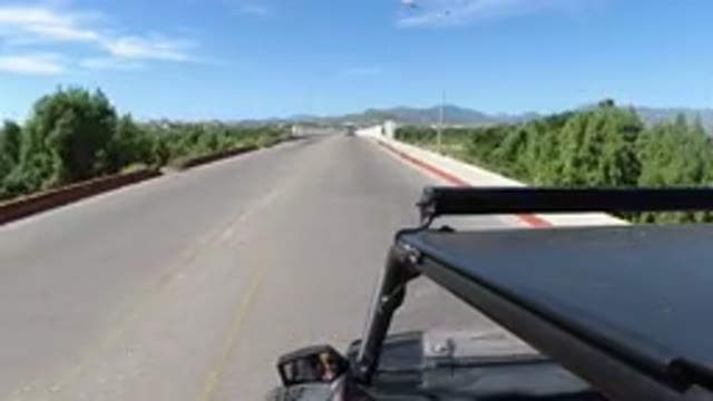 LOS CABOS MEXICO-2019: Jeep Driving Along Paved Road And Bridges On A Sunny Day
