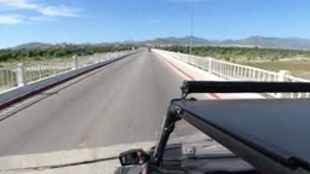 LOS CABOS MEXICO-2019: Jeep Wrangler Driving Across Bridge in Opposite Direction