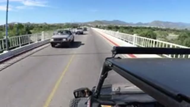LOS CABOS MEXICO-2019: Wrangler Moving Across Bridge Near Beach