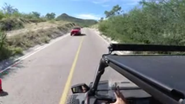 LOS CABOS MEXICO-2019: Black Jeep Wrangler Drives Along Two-Way Road