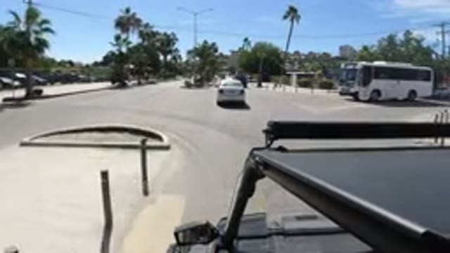 LOS CABOS MEXICO-2019: Wrangler Stopping At A Crossroad As Bus Approaches