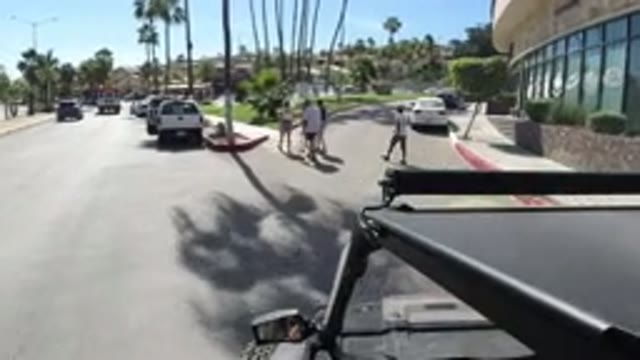 LOS CABOS MEXICO-2019: Slowing For Pedestrians At A Crosswalk In A Sunny Place