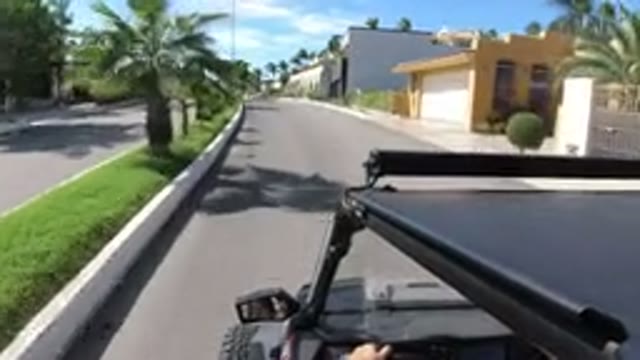 LOS CABOS MEXICO-2019: Someone Is Driving A Vehicle In A Nice Neighborhood On A