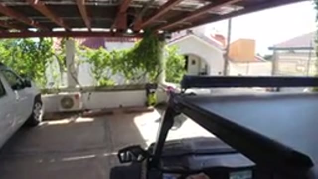 LOS CABOS MEXICO-2019: Quick Parking Outside Green Building with White Vehicle