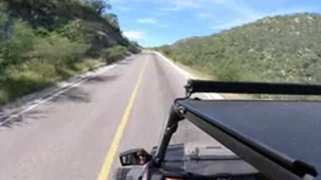 LOS CABOS MEXICO-2019: A Vehicle Driving on a Narrow Road on a Cloudy Day