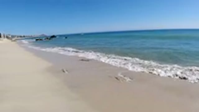 LOS CABOS MEXICO-2019: A View Of An Empty Beach With White Sand And Blue Water