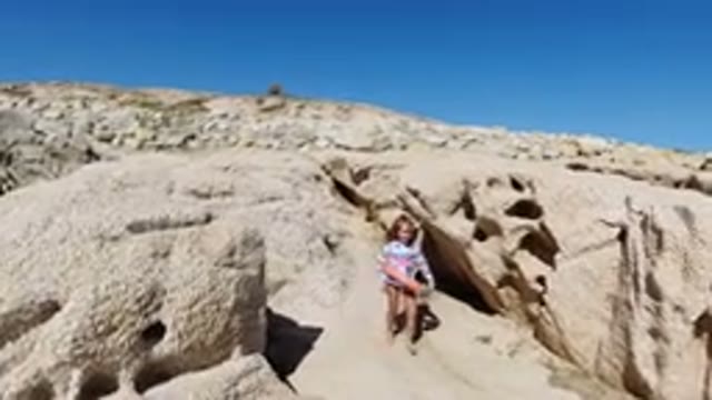 LOS CABOS MEXICO-2019: A Small Girl Wearing a Jacket on the Beach Side