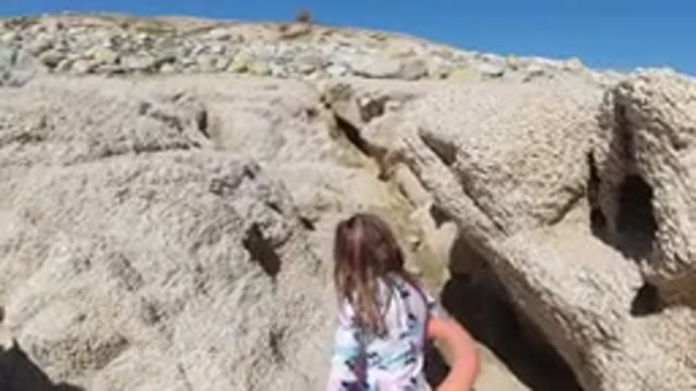 LOS CABOS MEXICO-2019: Young Girl Exploring Rocky Mountain Terrain In The Hot