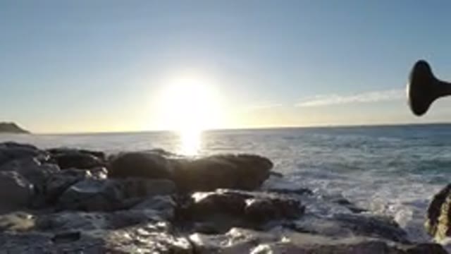 LOS CABOS MEXICO-2019: Sunrises And Water Lapping In A Beach And Hills Sky Cloud