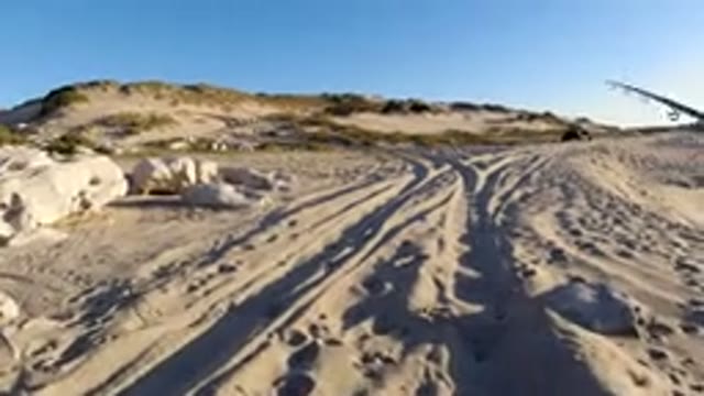 LOS CABOS MEXICO-2019: Person Filming Walking In The Sand With View Of Beach