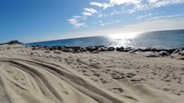LOS CABOS MEXICO-2019: A Beautiful Sandy Beach With Rocks As A Border With A
