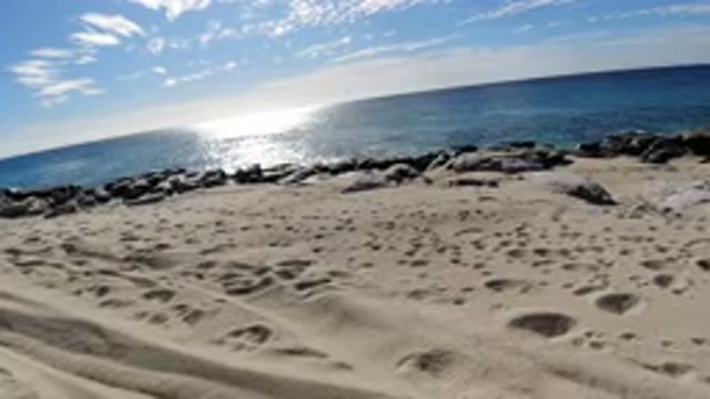 LOS CABOS MEXICO-2019: Beach Ocean Waves Rocks Sunshine Warm Hot Footprints Wind