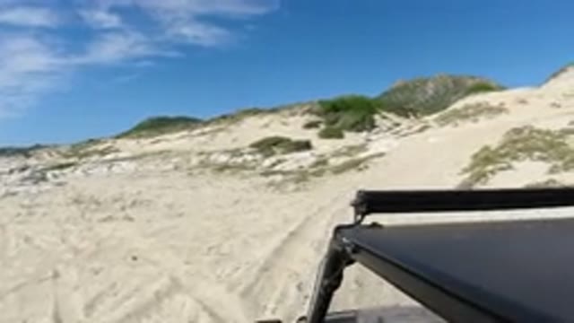 LOS CABOS MEXICO-2019: Camera Mounted To The Side Of A Jeep As The Wrangler Drives Up Incline