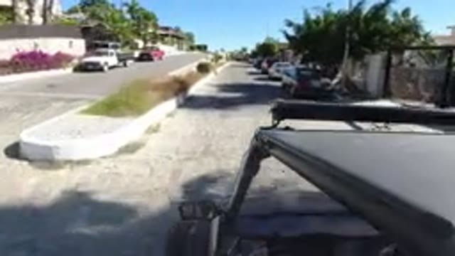 LOS CABOS MEXICO-2019: A Wrangler Is Driving Through A Neighborhood On A Cloudy Day