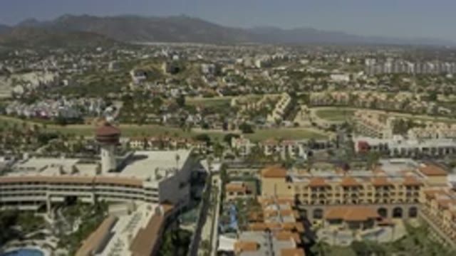 LOS CABOS MEXICO-2020: City Between Mountains on a Sunny Day with Moving Cars