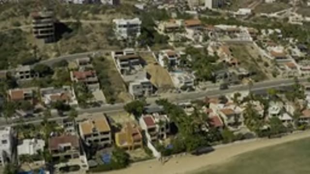 LOS CABOS MEXICO-2020: Beach Side View Of A Town With Lot Of Buildings And Mountains