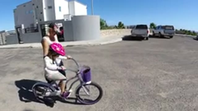 SAN JOSE DEL CABO MEXICO-2020: An Adult Teaching a Kid to Ride a Bicycle