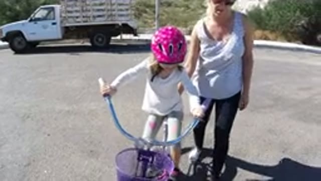 SAN JOSE DEL CABO MEXICO-2020: Mom Teaching Daughter How To Ride Her Bike For