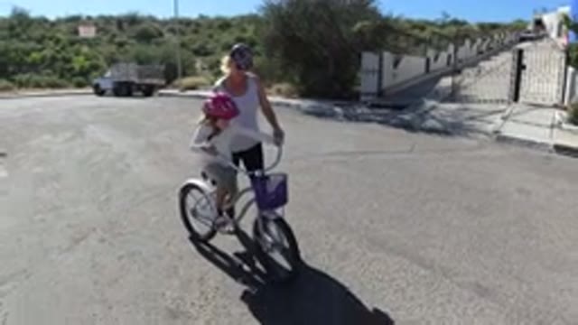 SAN JOSE DEL CABO MEXICO-2020: Mother Teaching Her Daughter How To Ride A Bicycle