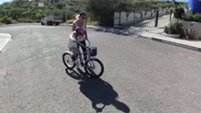 SAN JOSE DEL CABO MEXICO-2020: Little Girl Being Taught By Her Mother How To Ride A Bike