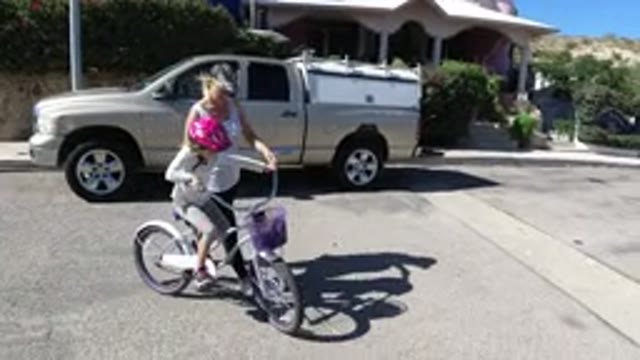 SAN JOSE DEL CABO MEXICO-2020: A Little Girl Learning to Cycle With Her Mom