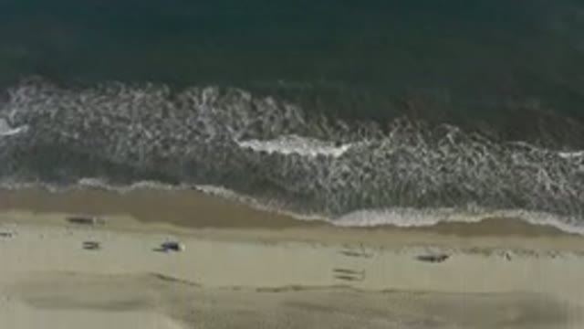 LOS CABOS MEXICO-2020: View Of A Beach Moving From The Water To The Sand During