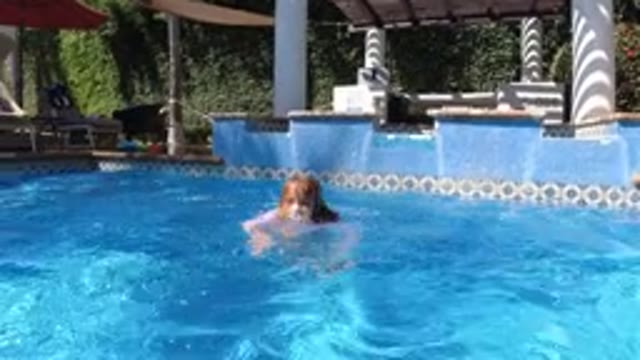 SAN JOSE DEL CABO MEXICO-2020: Child Swimming in Pool, Treading Water, Enjoying Summer Fun