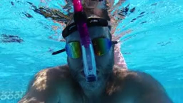 SAN JOSE DEL CABO MEXICO-2020: Man With Scuba Mask Submerging Face in Swimming Pool