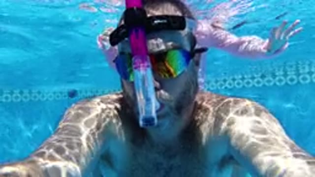 SAN JOSE DEL CABO MEXICO-2020: Man Diving Into Pool Wearing Diving Mask And Goggles