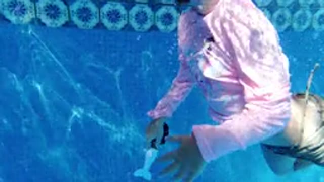 SAN JOSE DEL CABO MEXICO-2020: A Small Girl Swimming Under the Pool and Shows