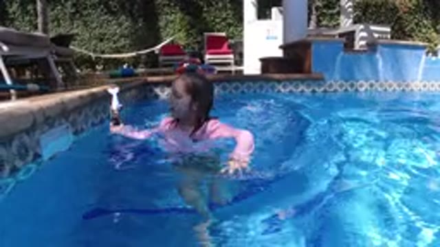SAN JOSE DEL CABO MEXICO-2020: Little Blonde Girl Playing With Her Toy While In Pool