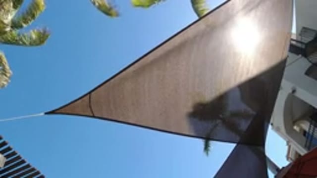 SAN JOSE DEL CABO MEXICO-2020: A Cloth Tied Upside Down in the Wind Outside Apartments