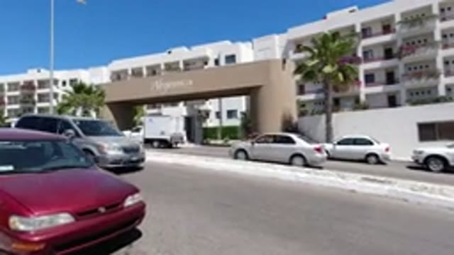 LOS CABOS MEXICO-2020: Walking Down The Street With A View Of A Big Hotel And
