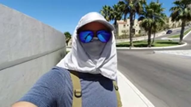 LOS CABOS MEXICO-2020: A Person Wearing Blue Face Mask and Glasses
